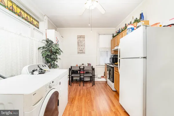 a utility room with sink dryer and washer