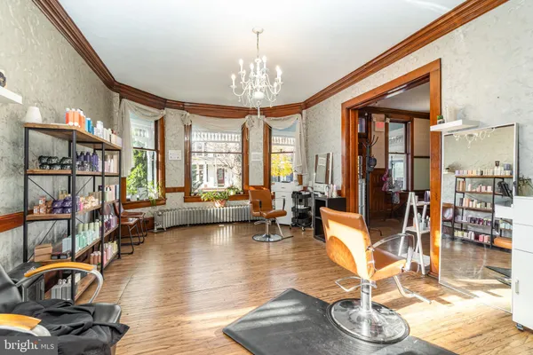 a living room with furniture a rug and a window