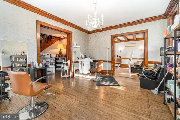 a view of a livingroom with furniture and a large window