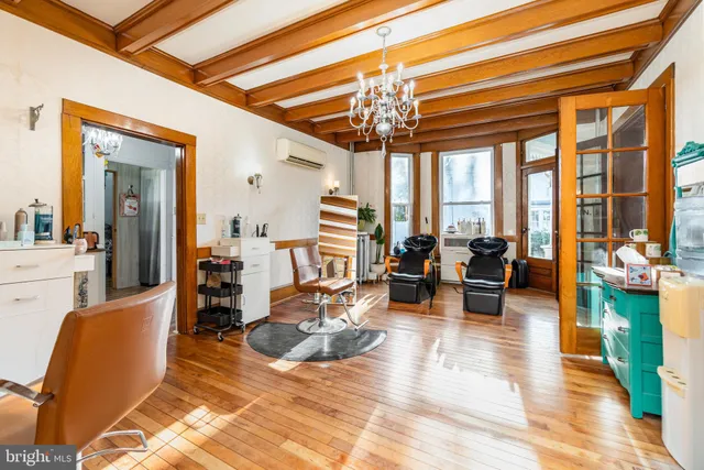 a view of a livingroom with furniture window and wooden floor