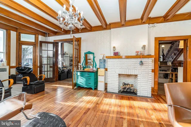 a living room filled with furniture and a chandelier