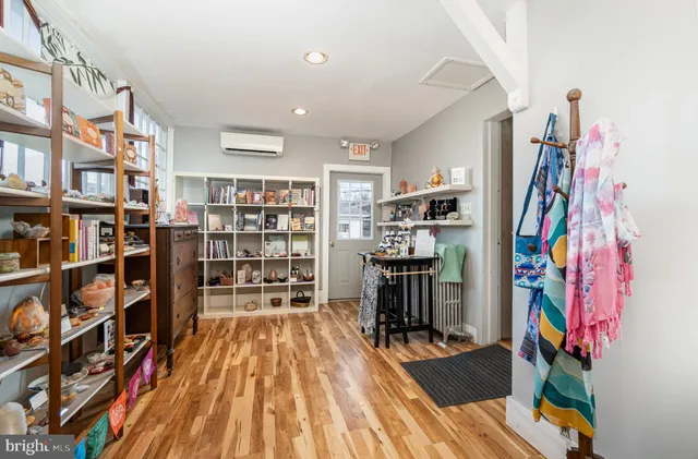 a kitchen with white cabinets and sink