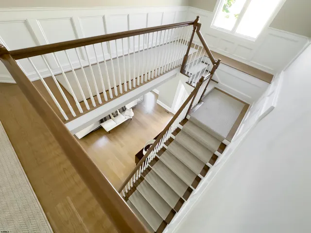 a view of staircase with black white walls