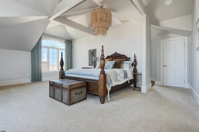 a bedroom with bed and window