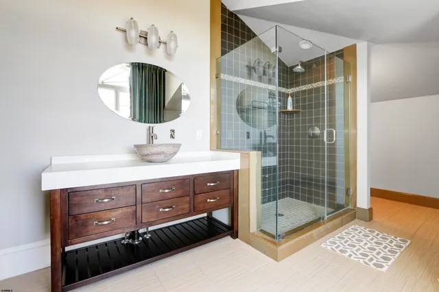 a bathroom with a sink a double vanity and a mirror