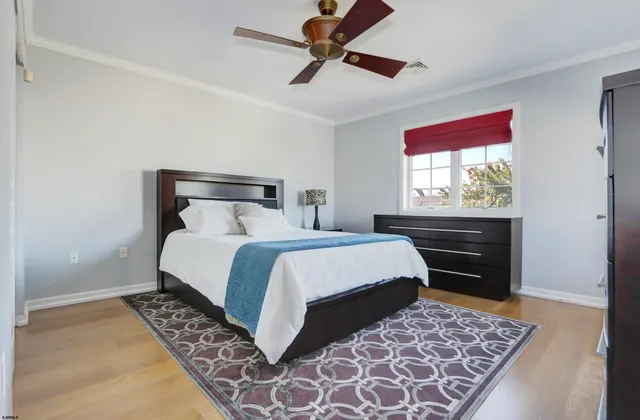 a bedroom with a bed and dresser