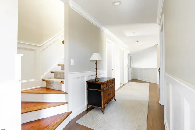 a living room with furniture and a piano