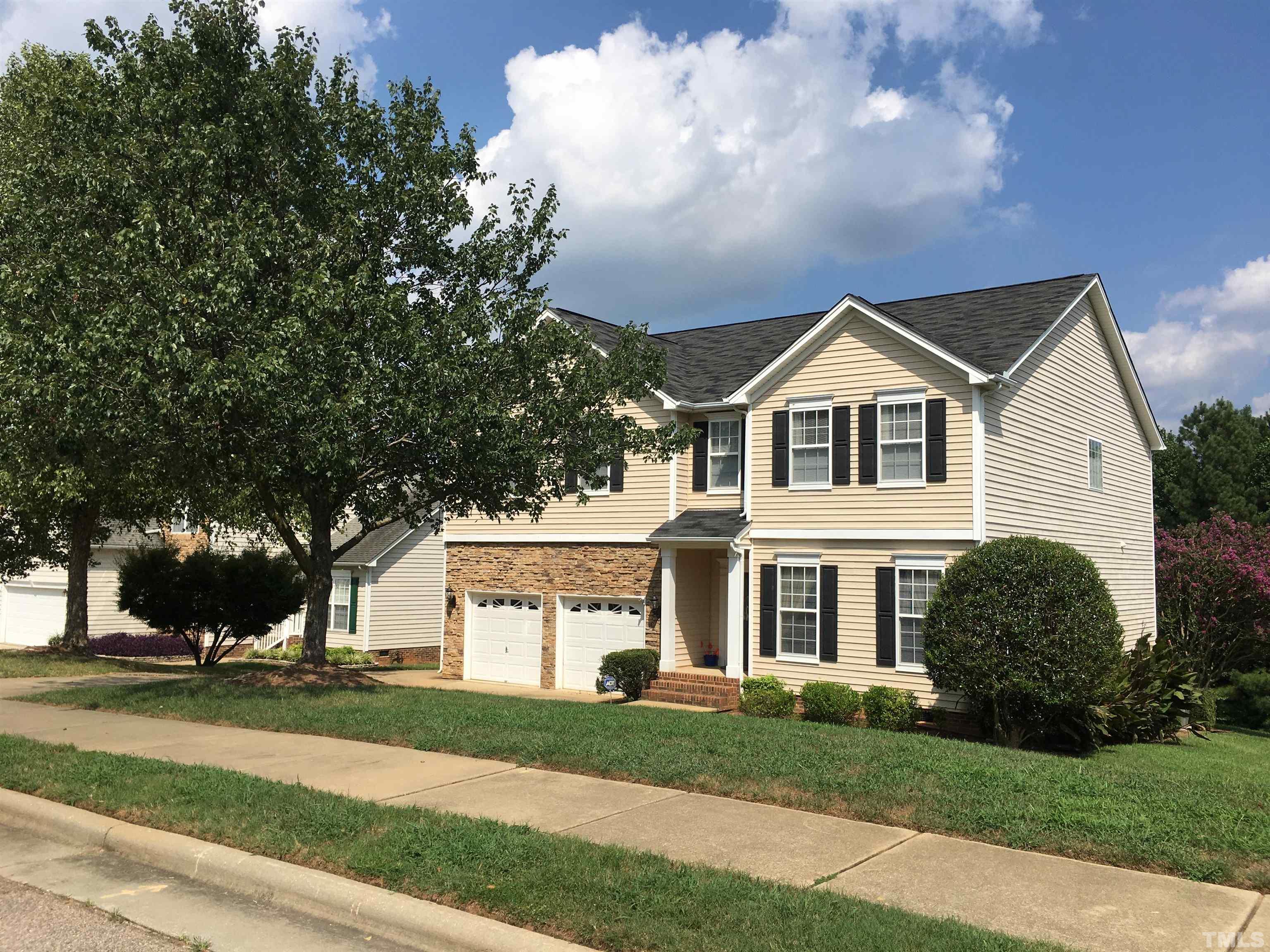 664 Seastone Street Raleigh, NC 27603 - Photo 1 of 25 a front view of a house with a yard