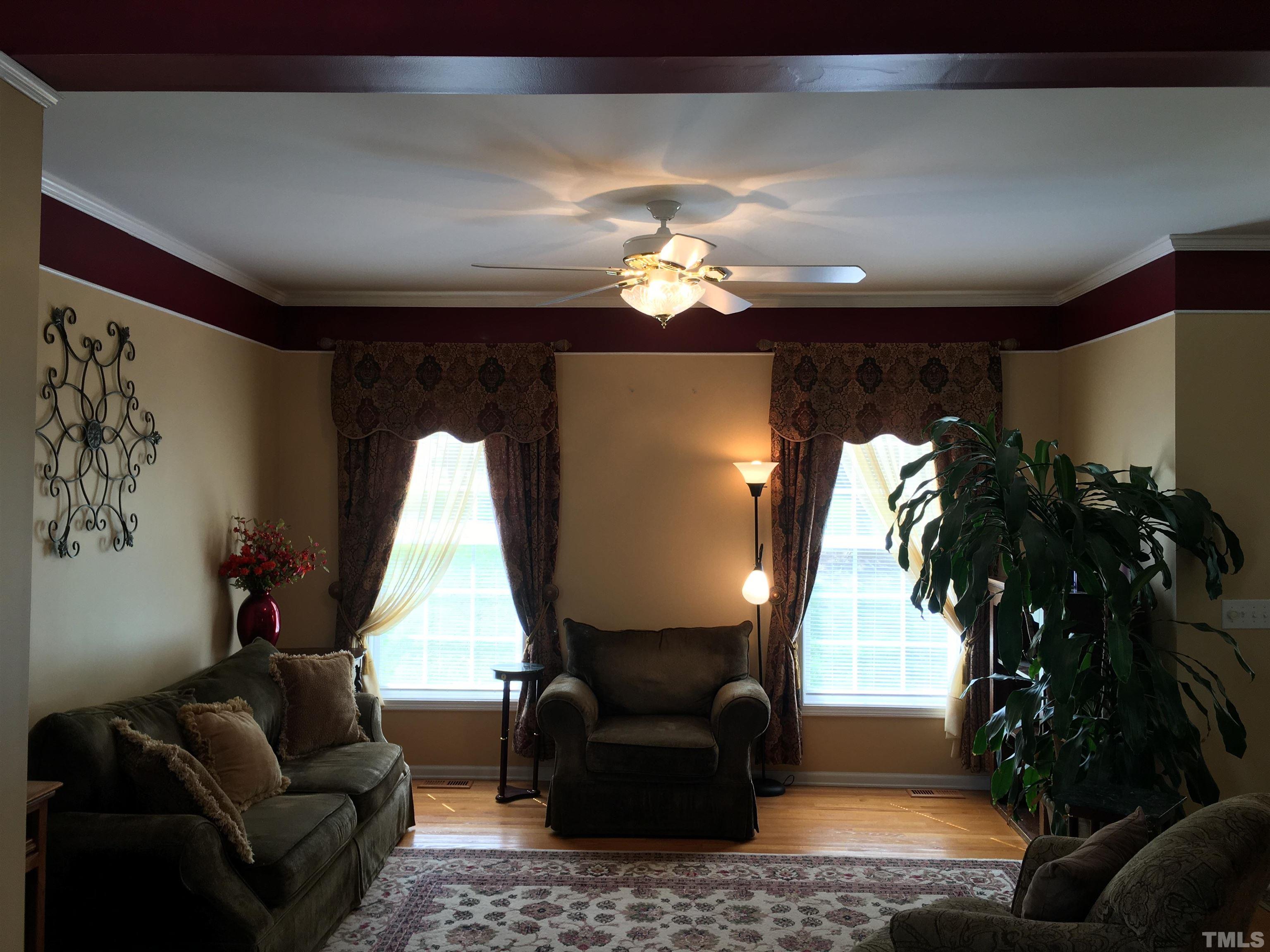 664 Seastone Street Raleigh, NC 27603 - Photo 2 of 25 a living room with furniture and a large window