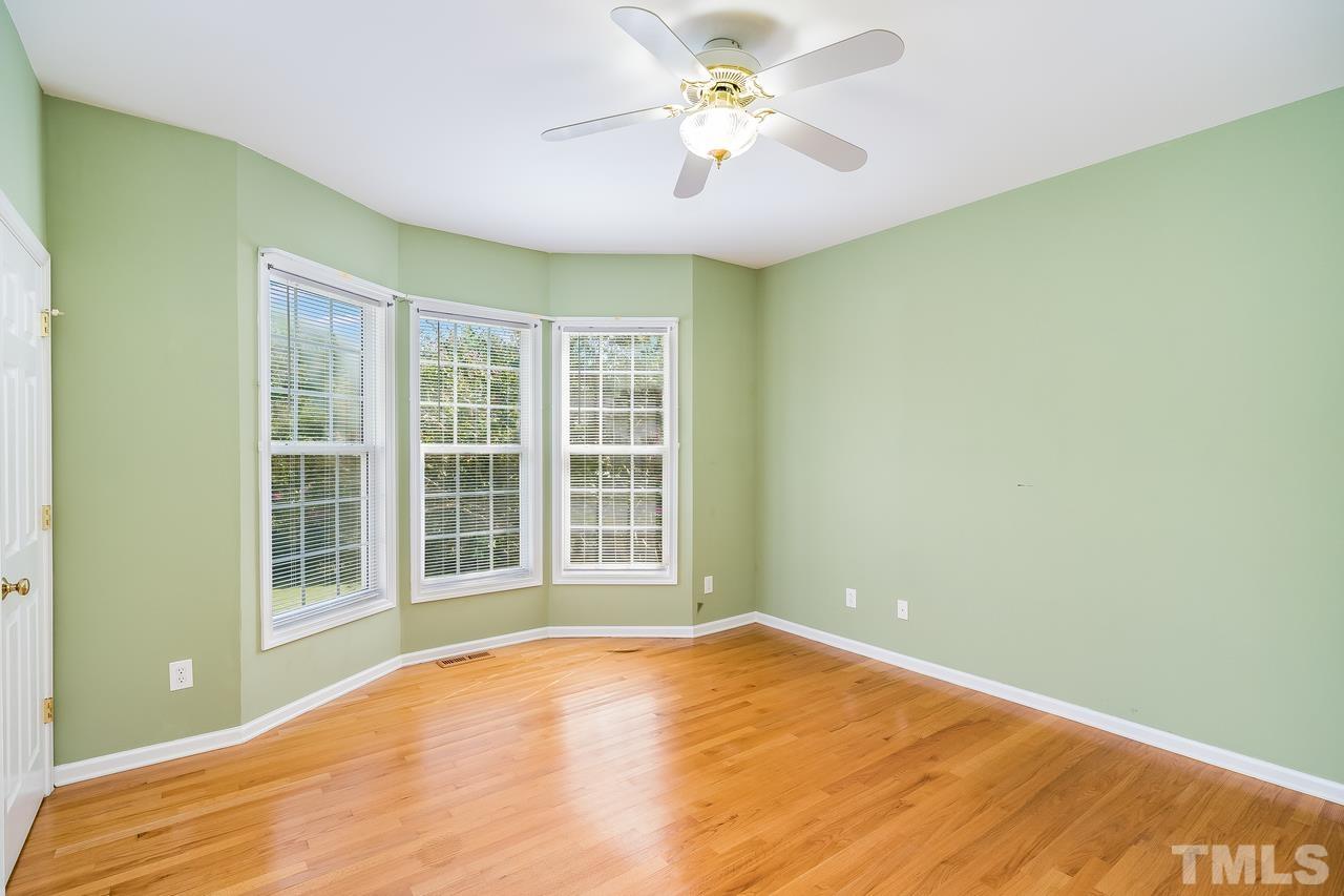 664 Seastone Street Raleigh, NC 27603 - Photo 9 of 25 a view of an empty room with a window