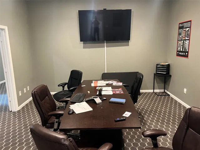 a workspace with furniture and wooden floor