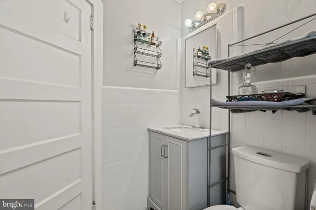 a view of a storage and utility room with a sink