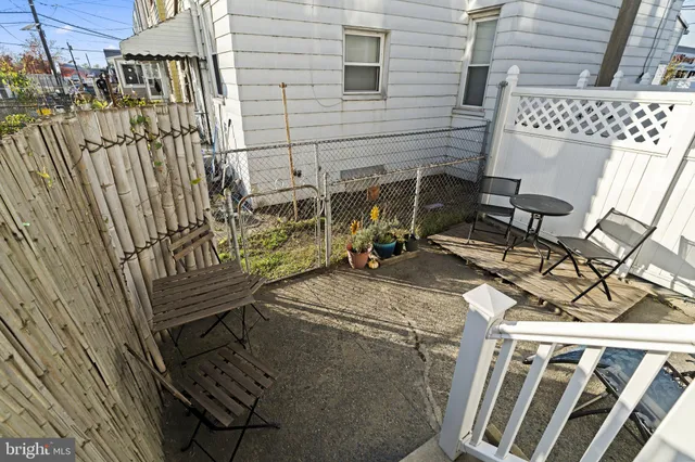 a view of a house with a wooden deck