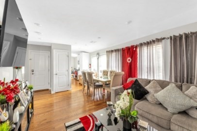 13 Pierce Street, Unit 5 Boston, MA 02136 - Photo 2 of 8 a living room with furniture and a large window