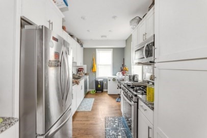 13 Pierce Street, Unit 5 Boston, MA 02136 - Photo 5 of 8 a kitchen with stainless steel appliances a refrigerator a stove a sink and a refrigerator