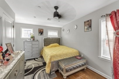13 Pierce Street, Unit 5 Boston, MA 02136 - Photo 6 of 8 a bedroom with a bed and a table