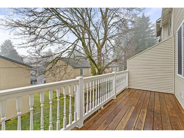 a view of backyard with a deck
