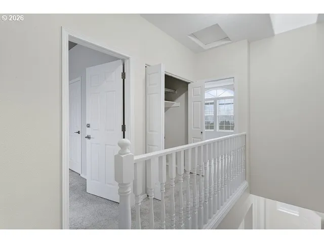 a view of an entryway with wooden floor