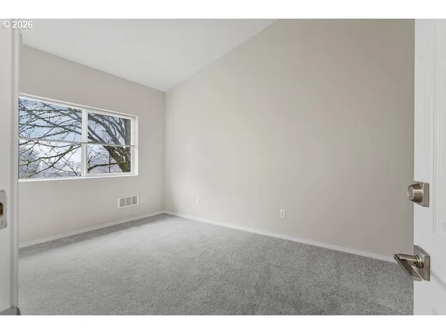 a view of an empty room and window