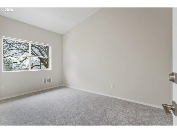 a view of an empty room and window