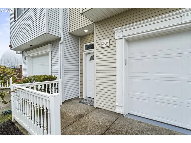 a view of a house with backyard and deck