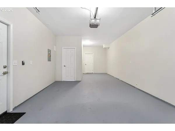 a view of a room with a ceiling fan