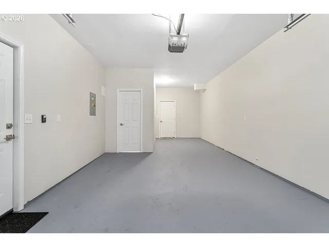 a view of a room with a ceiling fan