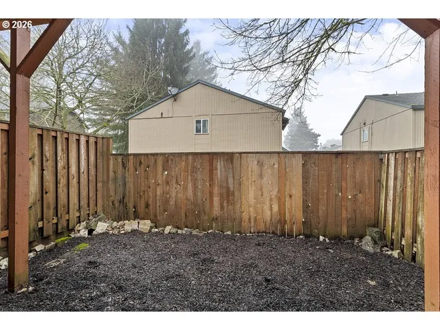 a view of outdoor space and wooden fence