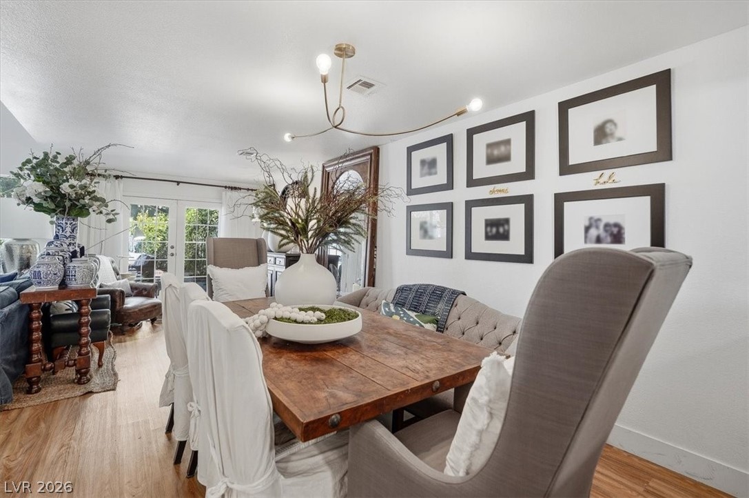 6250 West Flamingo Road, Unit 93 Las Vegas, NV 89103 - Photo 15 of 38 This inviting dining area features a rich wooden table, perfect for gatherings and creating cherished memories.
