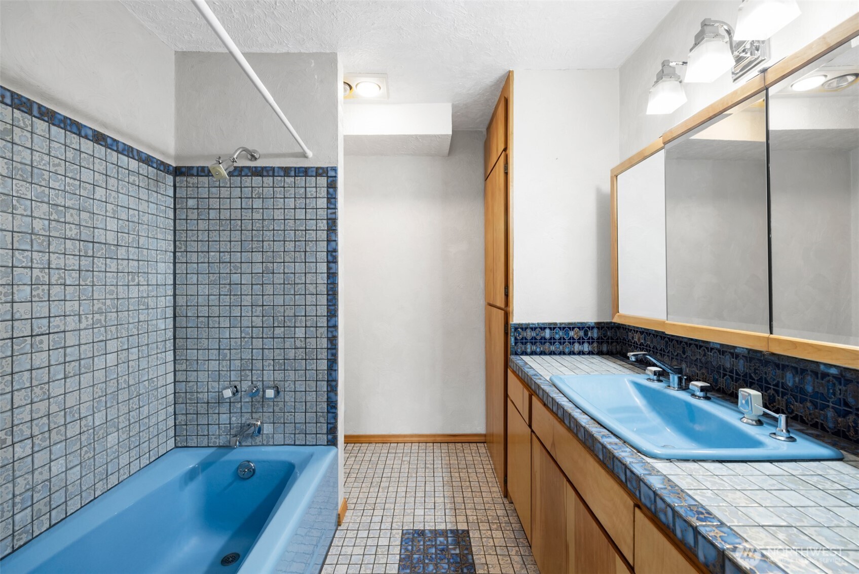 453 Stampede Drive Sequim, WA 98382 - Photo 23 of 36 a bathroom with a sink double vanity and a shower