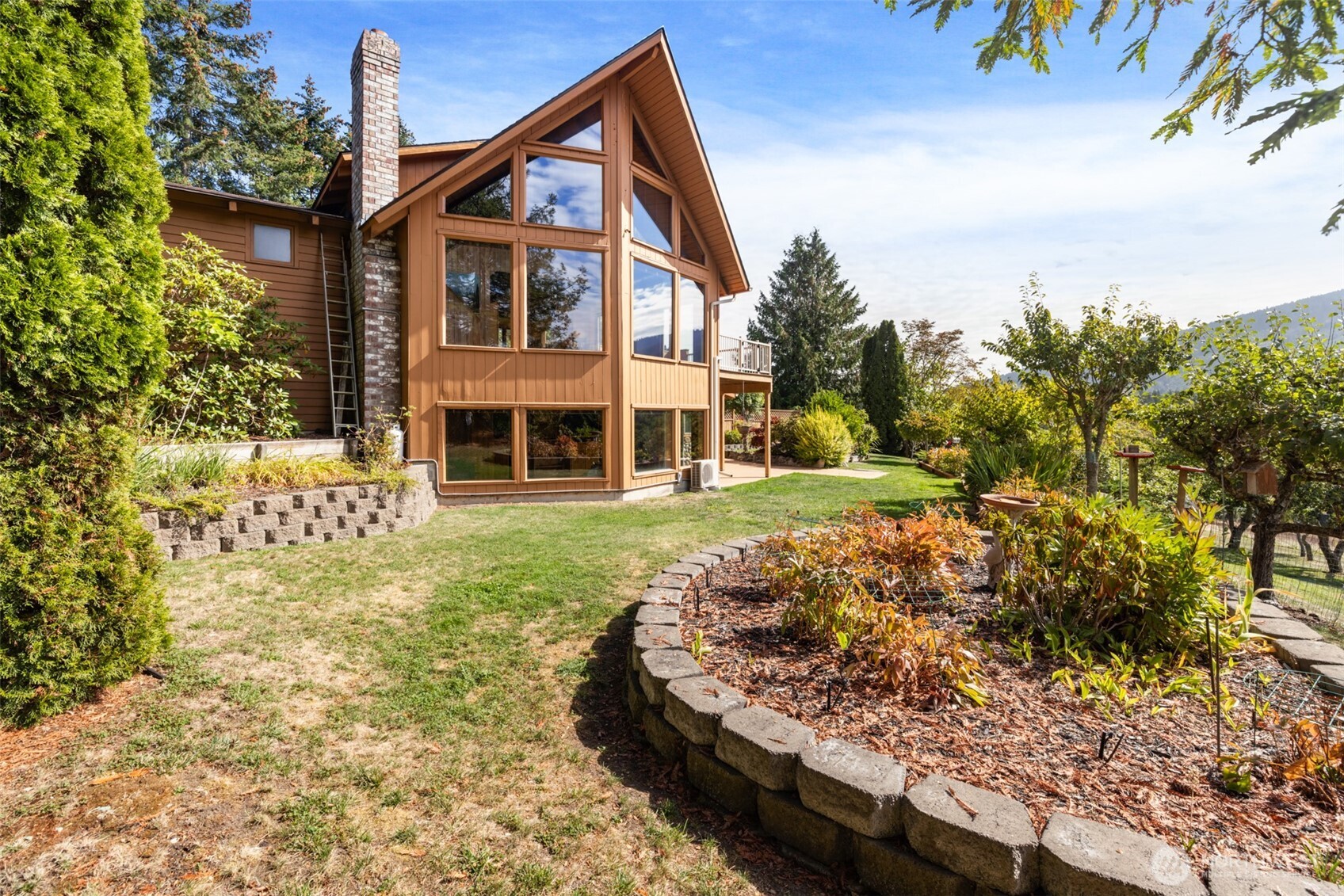 453 Stampede Drive Sequim, WA 98382 - Photo 33 of 36 a front view of a house with a yard