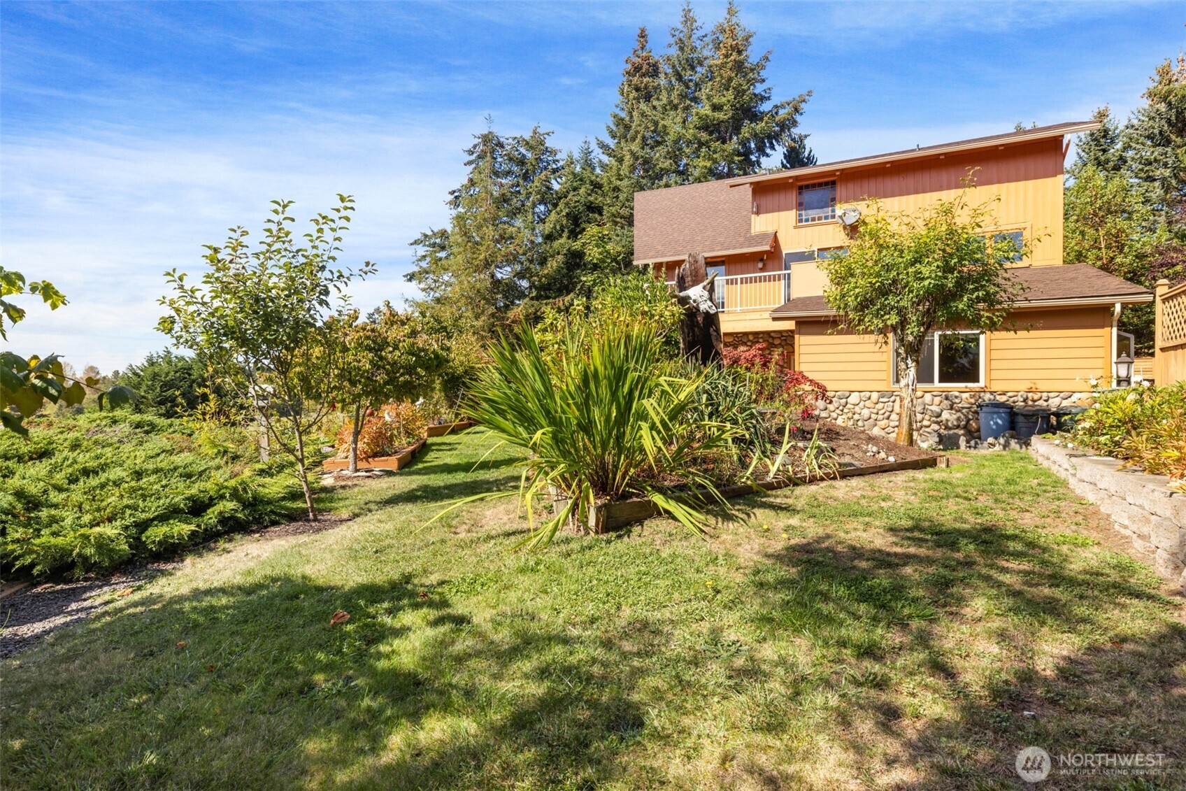 453 Stampede Drive Sequim, WA 98382 - Photo 36 of 36 a view of a house with a yard