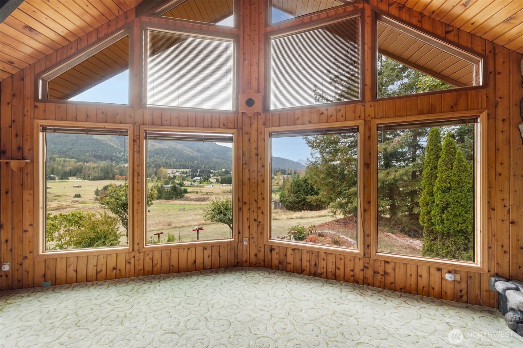 453 Stampede Drive Sequim, WA 98382 - Photo 6 of 36 an empty room with wooden floor and garden