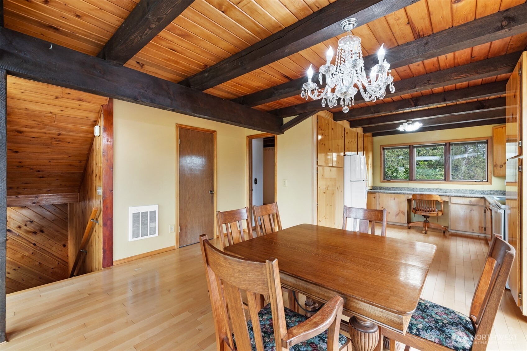 453 Stampede Drive Sequim, WA 98382 - Photo 9 of 36 a dining room with furniture a chandelier and wooden floor