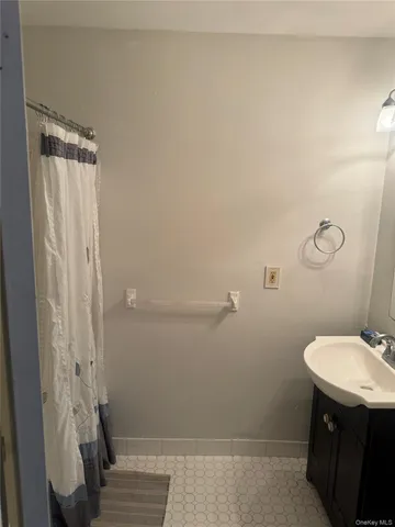 a bathroom with a sink and toilet