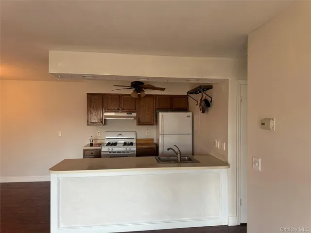 a kitchen with a stove and a refrigerator