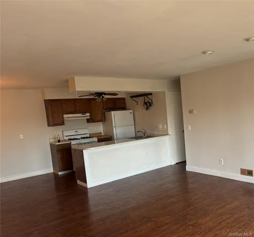 a view of kitchen with wooden floor