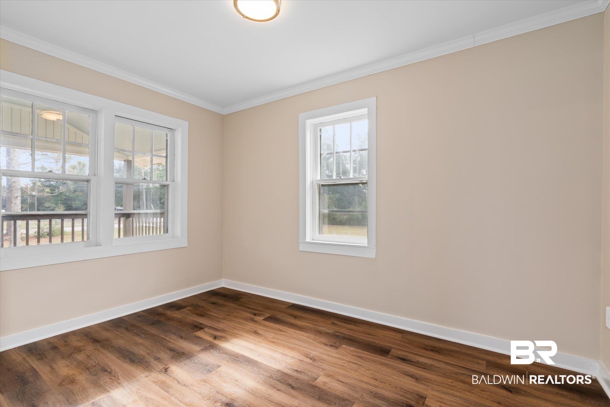 4630 General Road Mobile, AL 36619 - Photo 6 of 33 Unfurnished room with wood-type flooring and crown molding