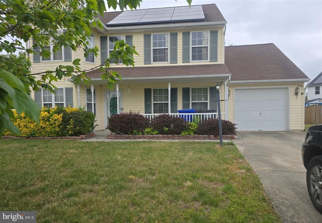 2448 Shellcove Court Waldorf, MD 20601 - Photo 1 of 18 a front view of a house with a yard and garage