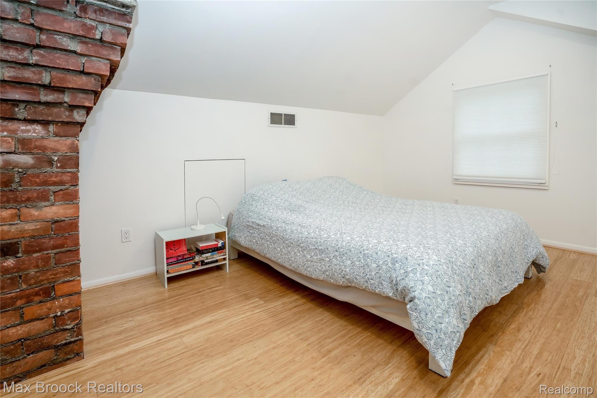 90 Amherst Road Pleasant Ridge, MI 48069 - Photo 23 of 43 Master bedroom with exposed brick