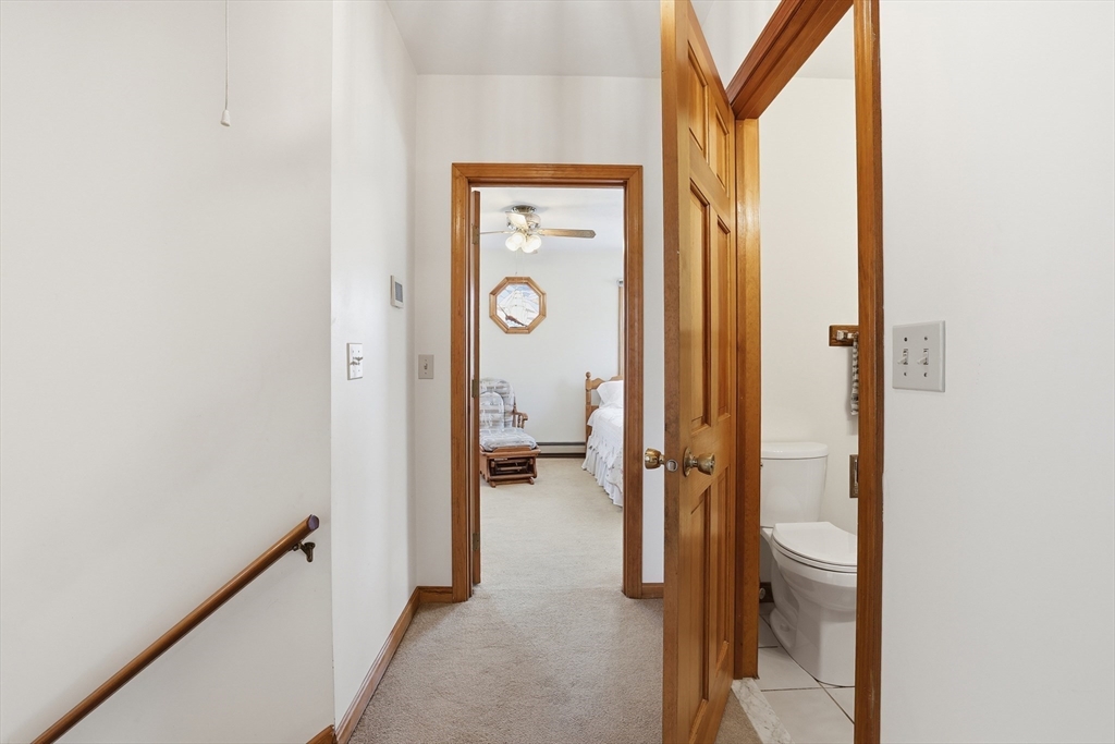7 Swift Avenue Wareham, MA 02571 - Photo 29 of 42 a view of a hallway with wooden floor and a livingroom
