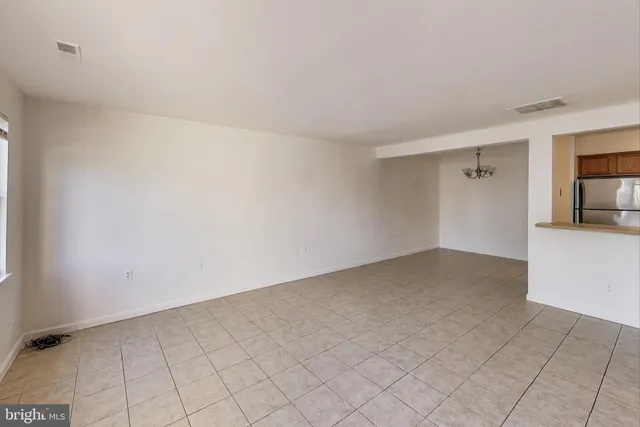 a view of an empty room and entryway