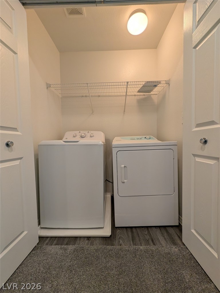 10308 Faustine Avenue Las Vegas, NV 89129 - Photo 17 of 28 A dedicated utility space for effortless laundry chores, complete with washer and dryer.