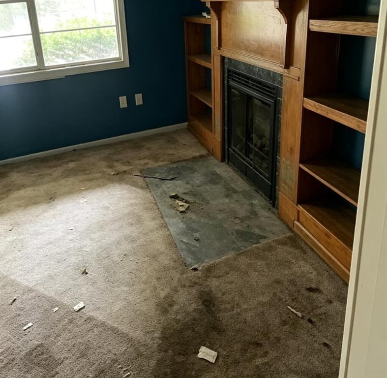 411 Stiles Road Selma, AL 36701 - Photo 5 of 7 a view of an empty room with a fireplace
