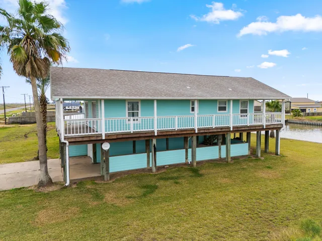 a view of a swimming pool with a table and chairs