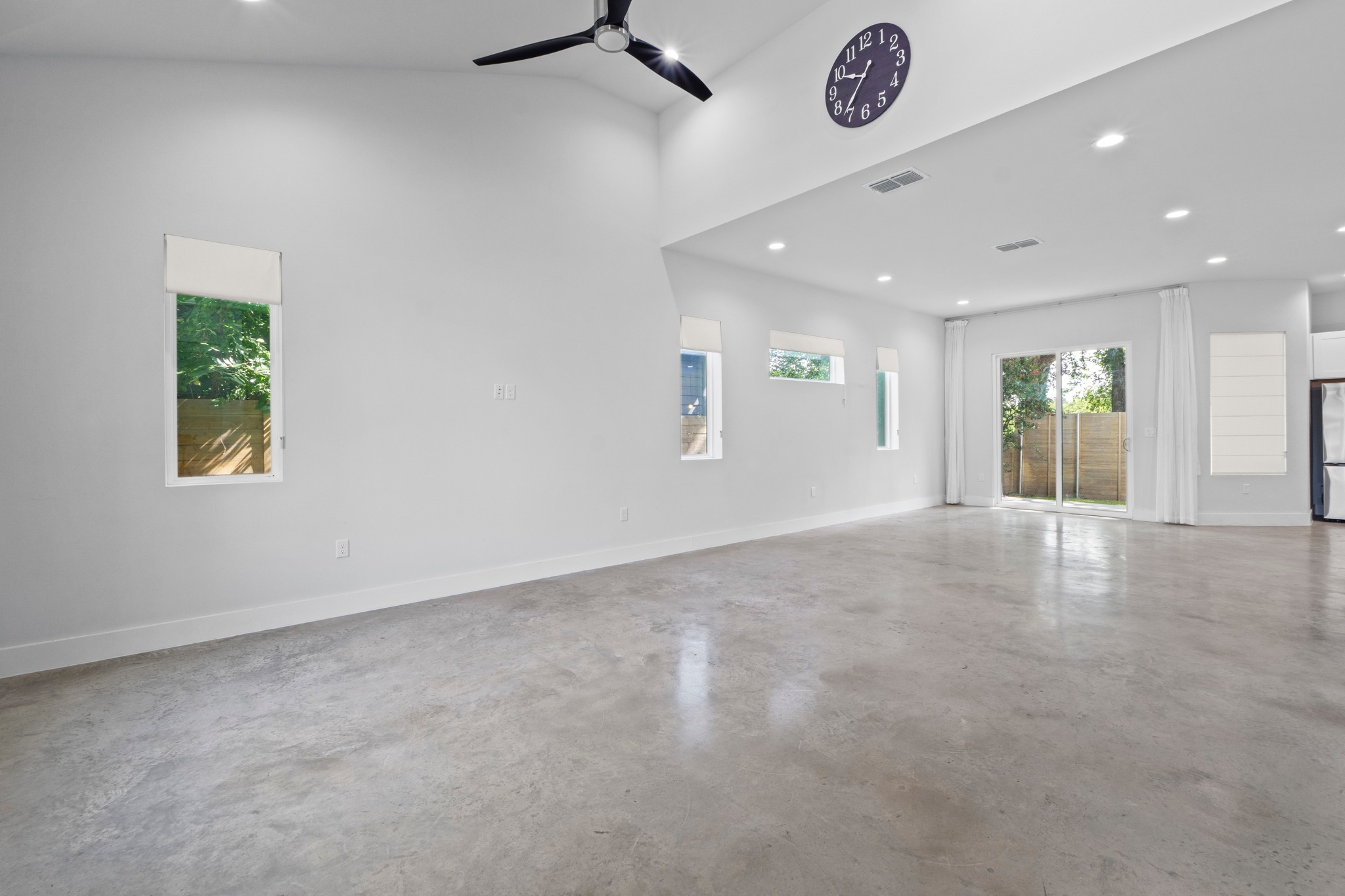 2007 Chestnut Avenue, Unit 1 Austin, TX 78722 - Photo 6 of 32 Lofty ceilings crown this versatile living space, offering ample room for custom design.