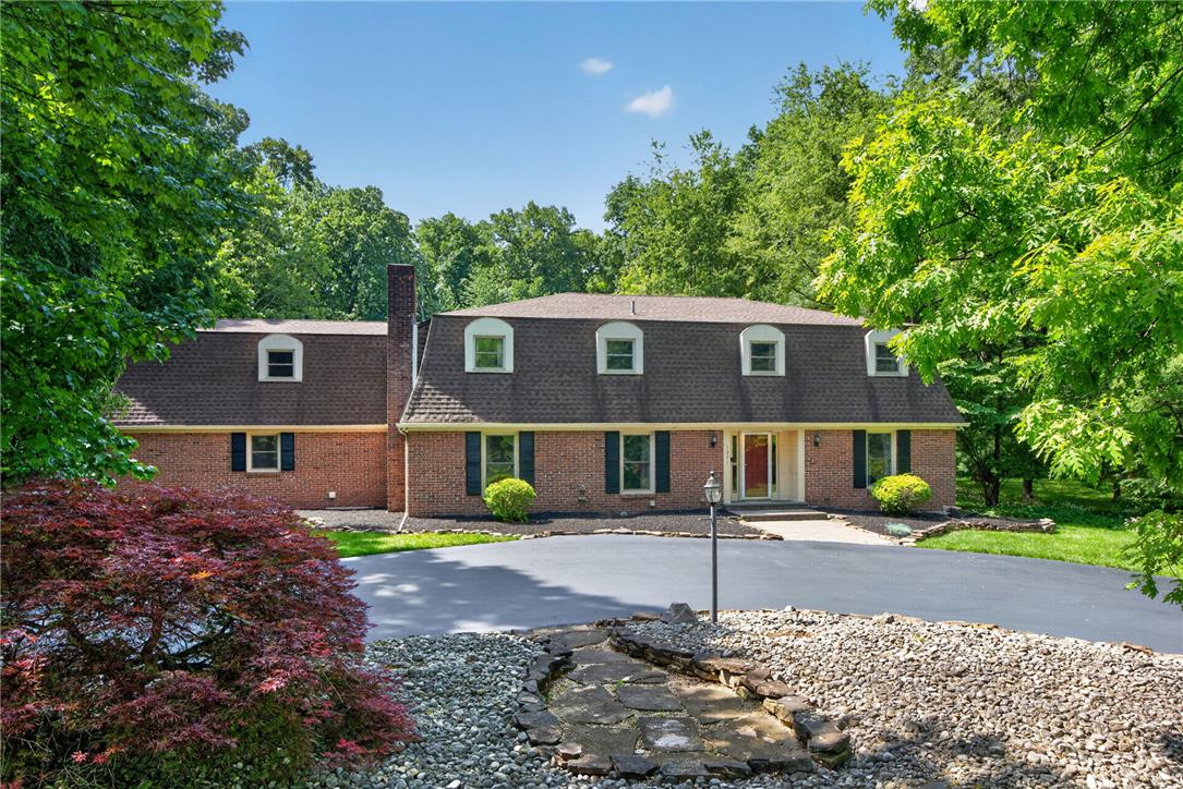 1371 Stoke Park Road Bethlehem, PA 18017 - Photo 55 of 55 a front view of a house with a yard and trees
