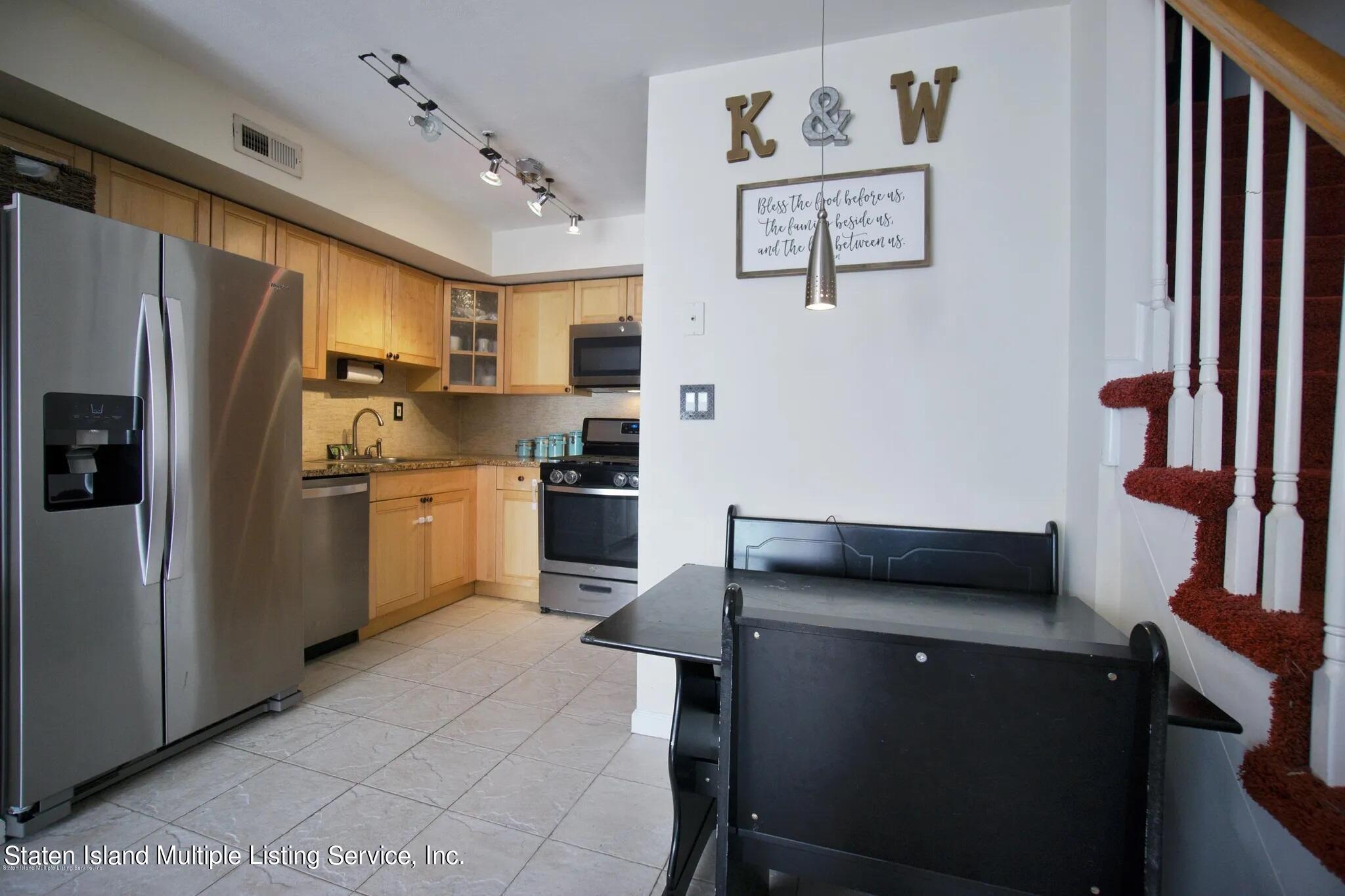 54 Selvin Loop Staten Island, NY 10303 - Photo 5 of 9 a kitchen with stainless steel appliances granite countertop a refrigerator sink and stove