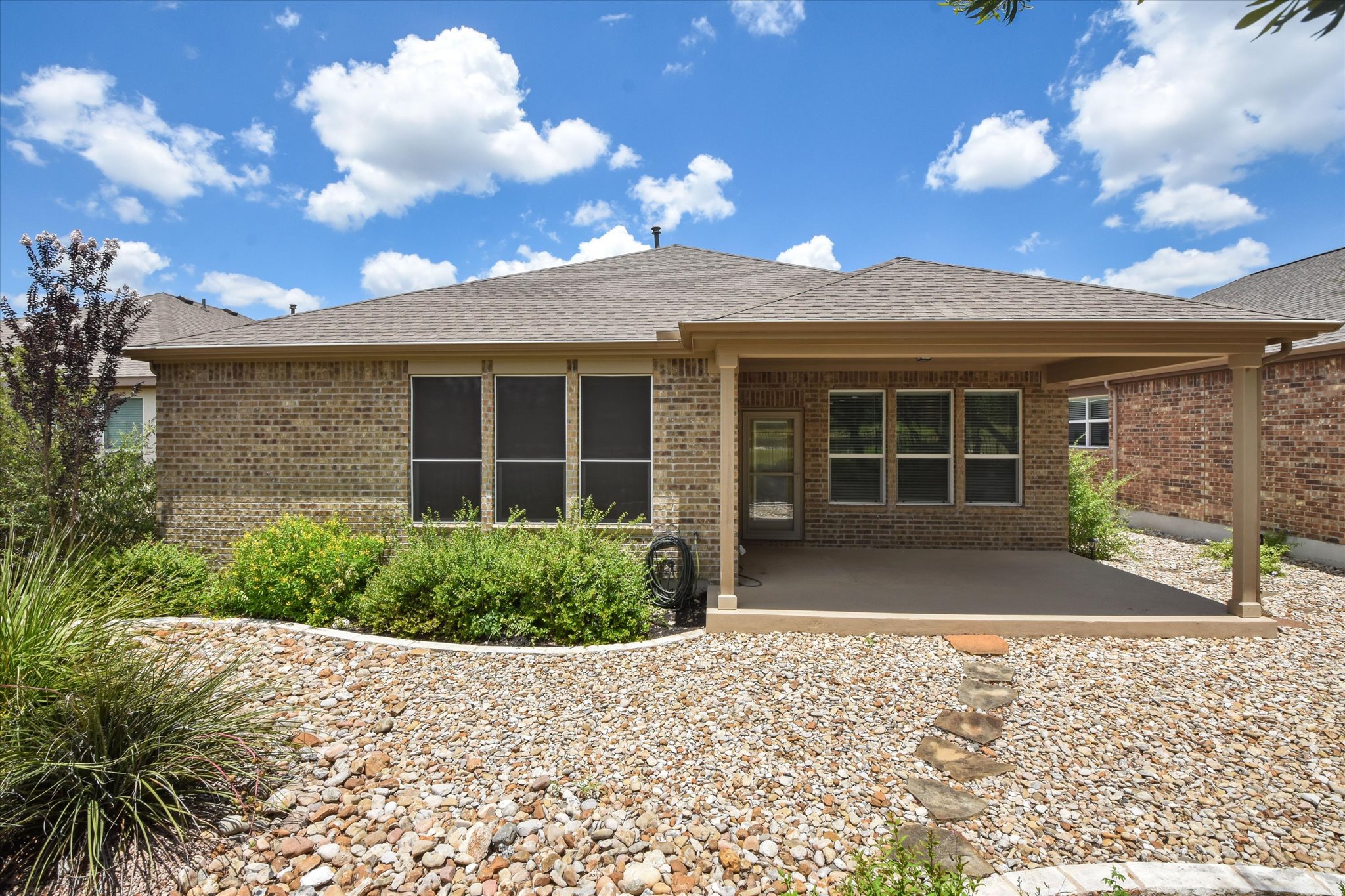 104 Coffee Mill Creek Road Georgetown, TX 78633 - Photo 30 of 40 Covered patio overlooking the beautifully landscaped, low maintenance backyard and a peaceful setting.