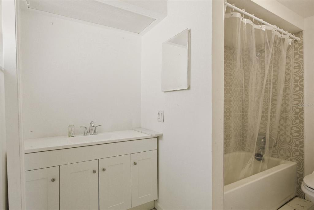 4276 Rudder Way New Port Richey, FL 34652 - Photo 18 of 29 a bathroom with a sink a toilet and shower